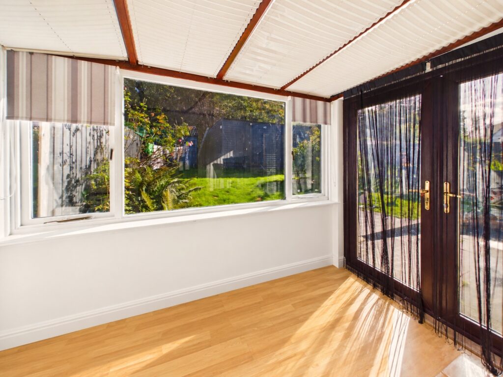 Sunlit Empty Room with Garden View